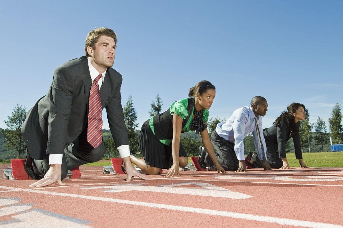 office worker in business attire in starting position on an outdoor track; Gender equality and AI in hiring concept