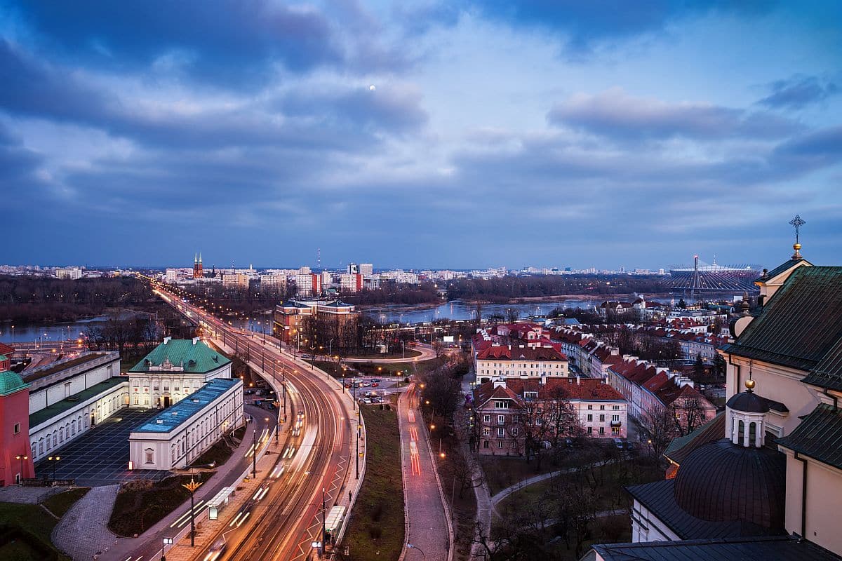 City of Warsaw evening cityscape, capital of Poland, Solidarity Avenue (Solidarnosci), view from downtown to river