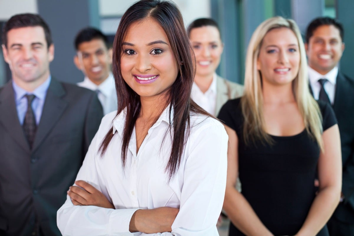 beautiful young indian businesswoman and team in office