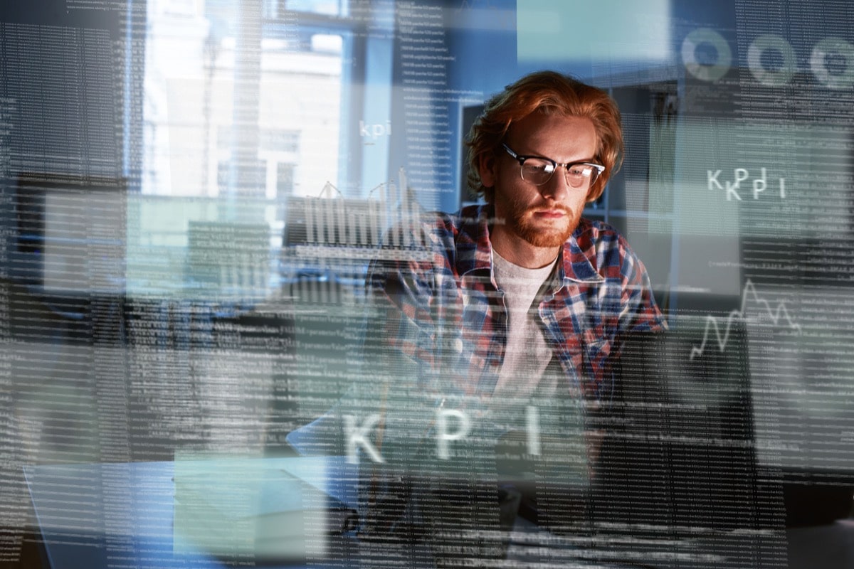 A red haired computer programmer who works on new code; future of work concept