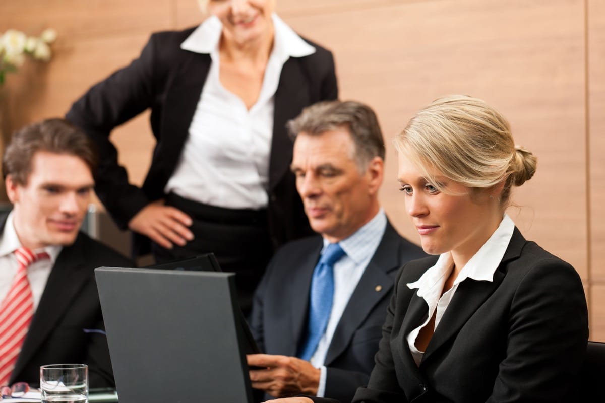 business - team meeting in an office; succession planning concept