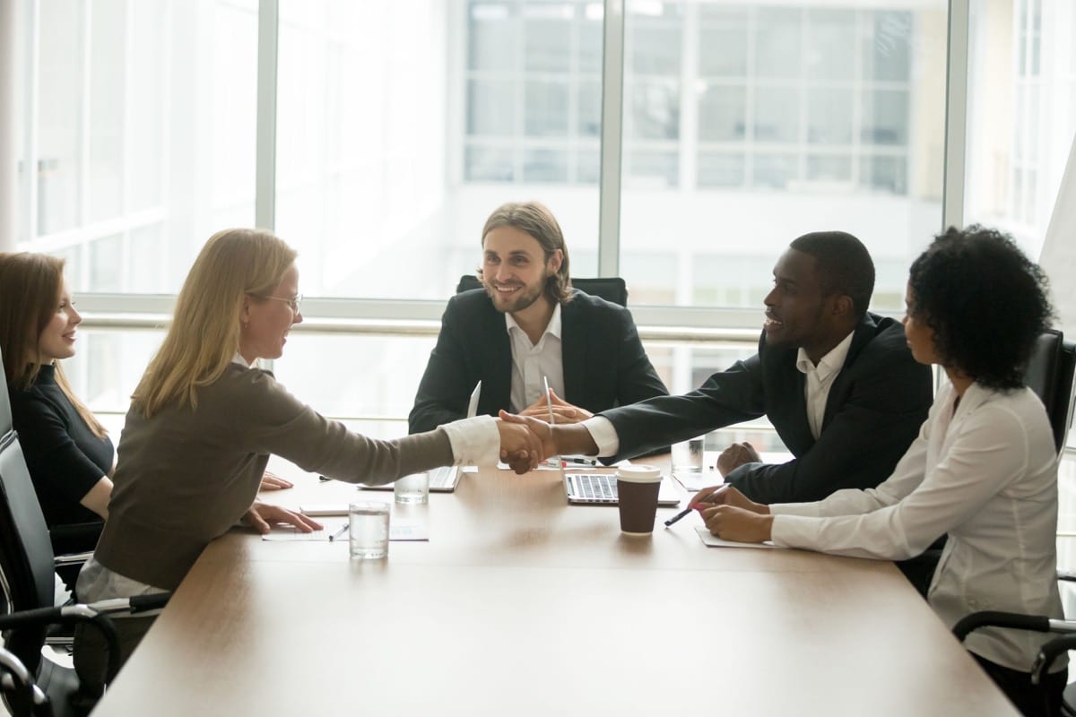 Businessman and businesswoman shaking hands