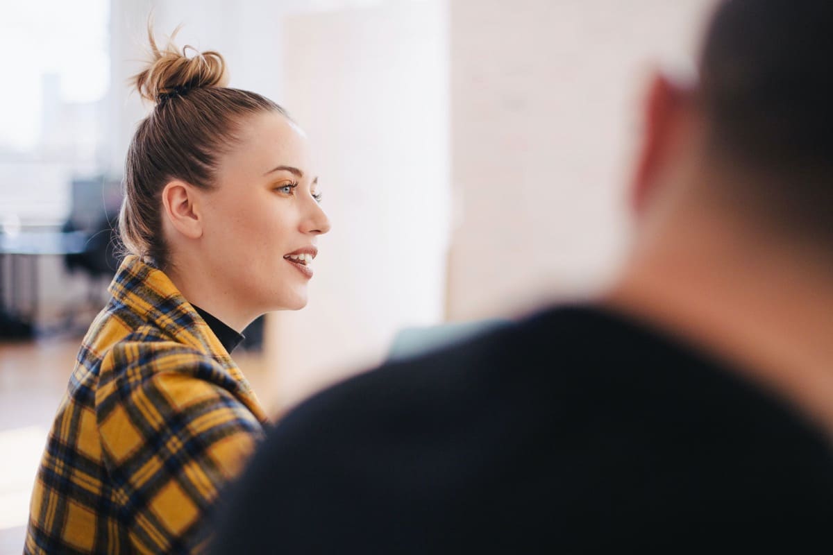 businesswoman addresses a meeting; Hiring During Recession concept