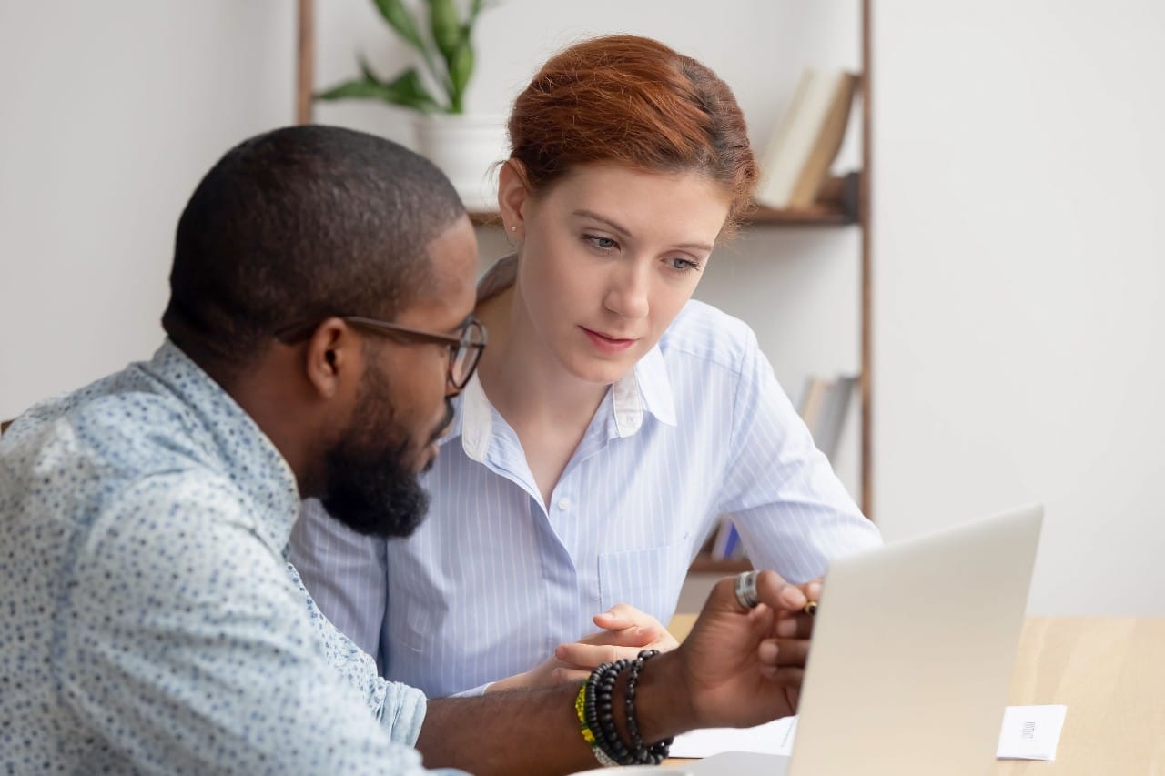 two professions work together at a laptop; contingent workers concept