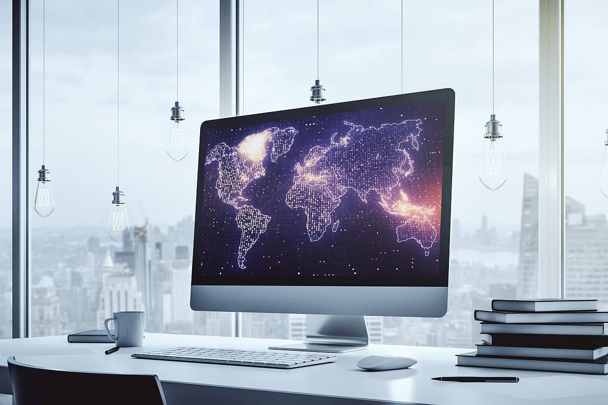 Abstract digital world map on modern computer monitor; hire global talent concept