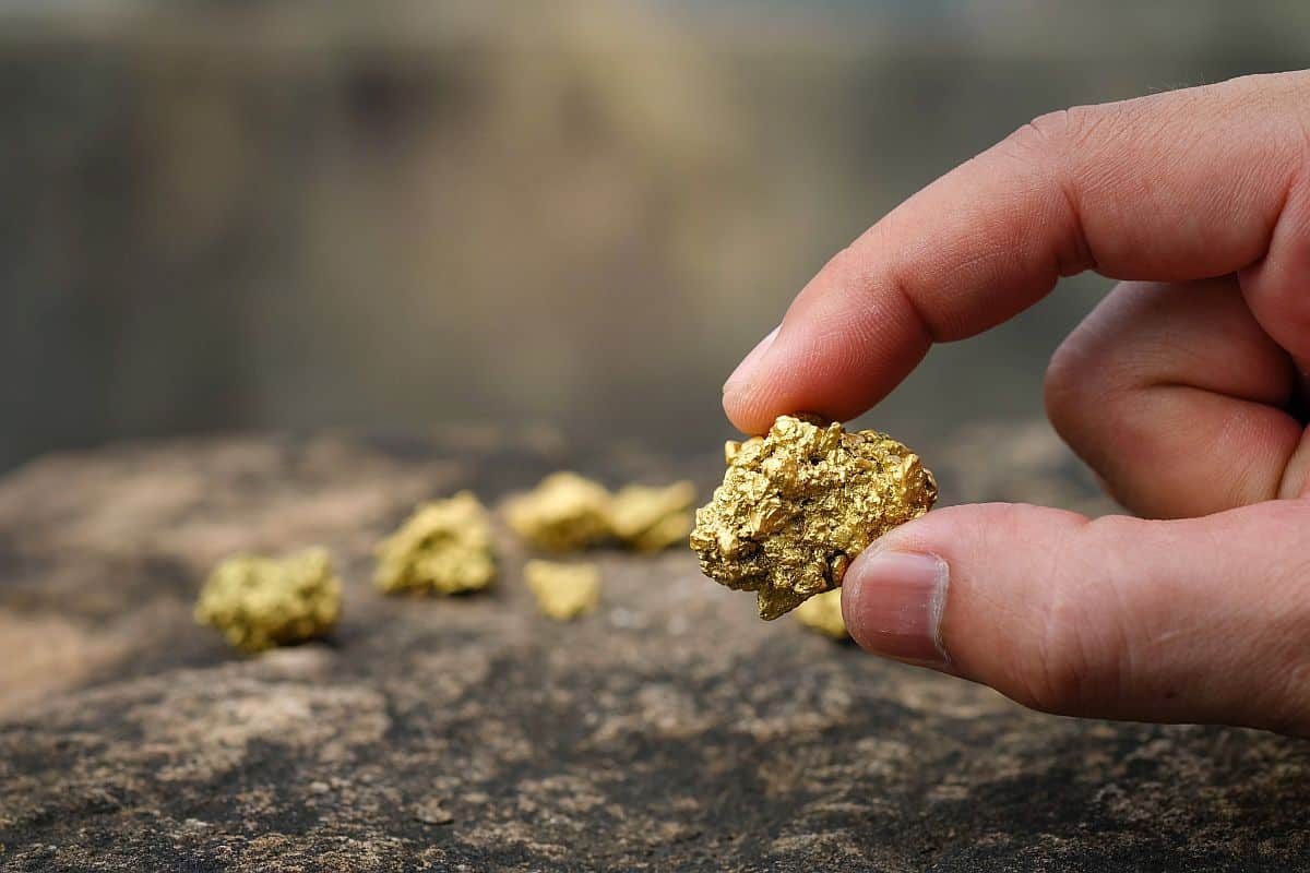Gold ore in hand; Hiring for Telecom concept