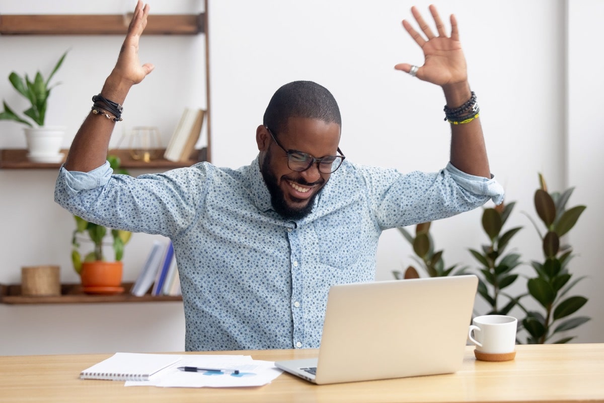 businessman happy to read great online news; talent management after hiring concept