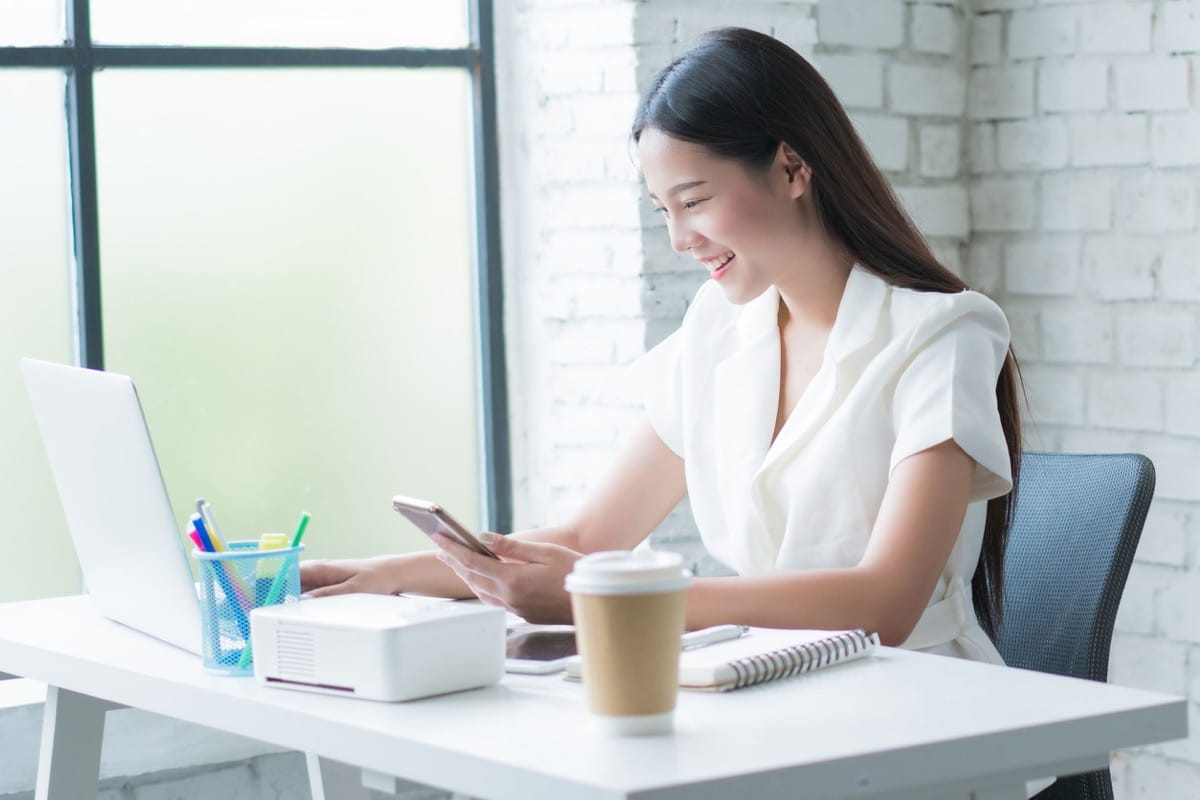 women working at desk in her home; Manage Remote Workers concept