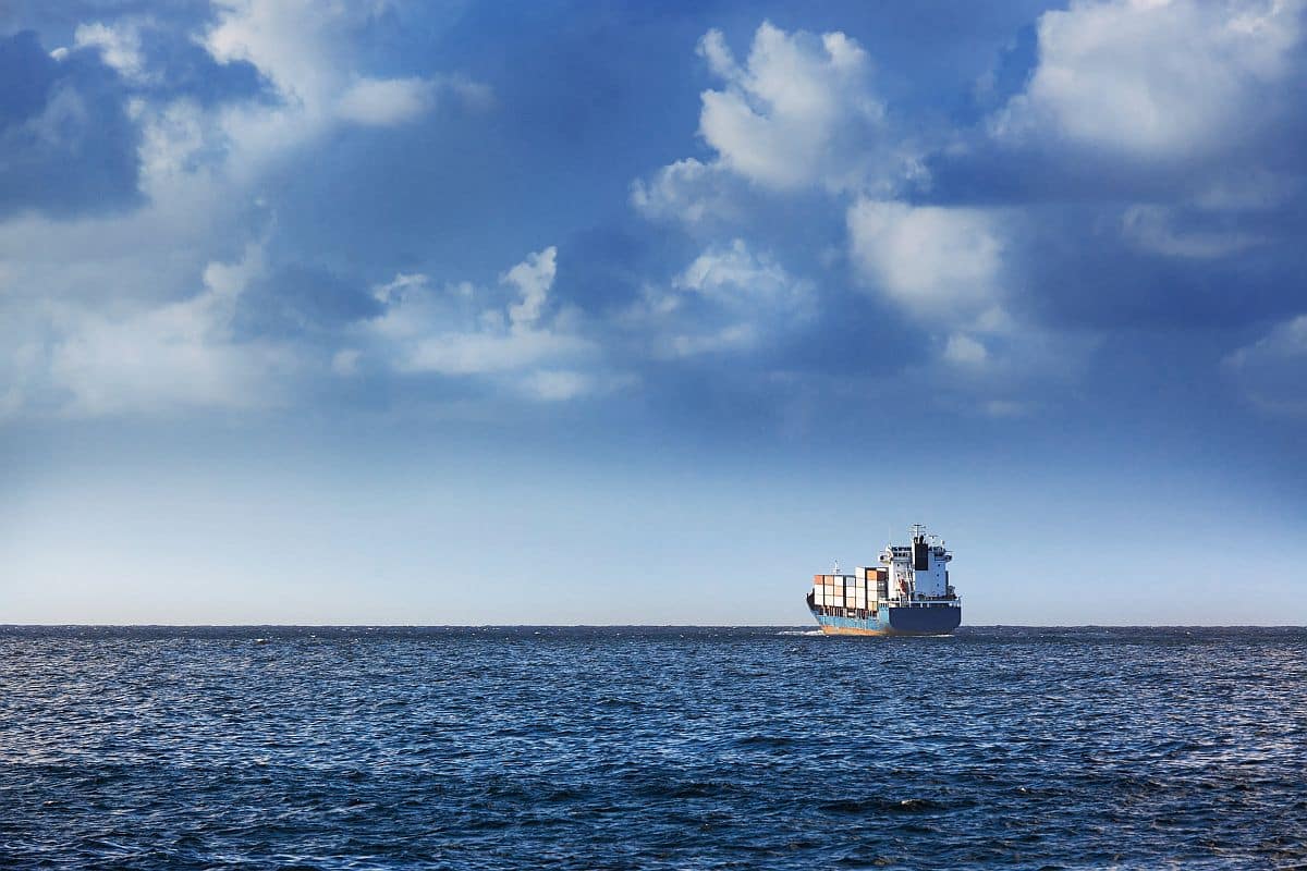cargo ship in the ocean; semiconductor industry concept