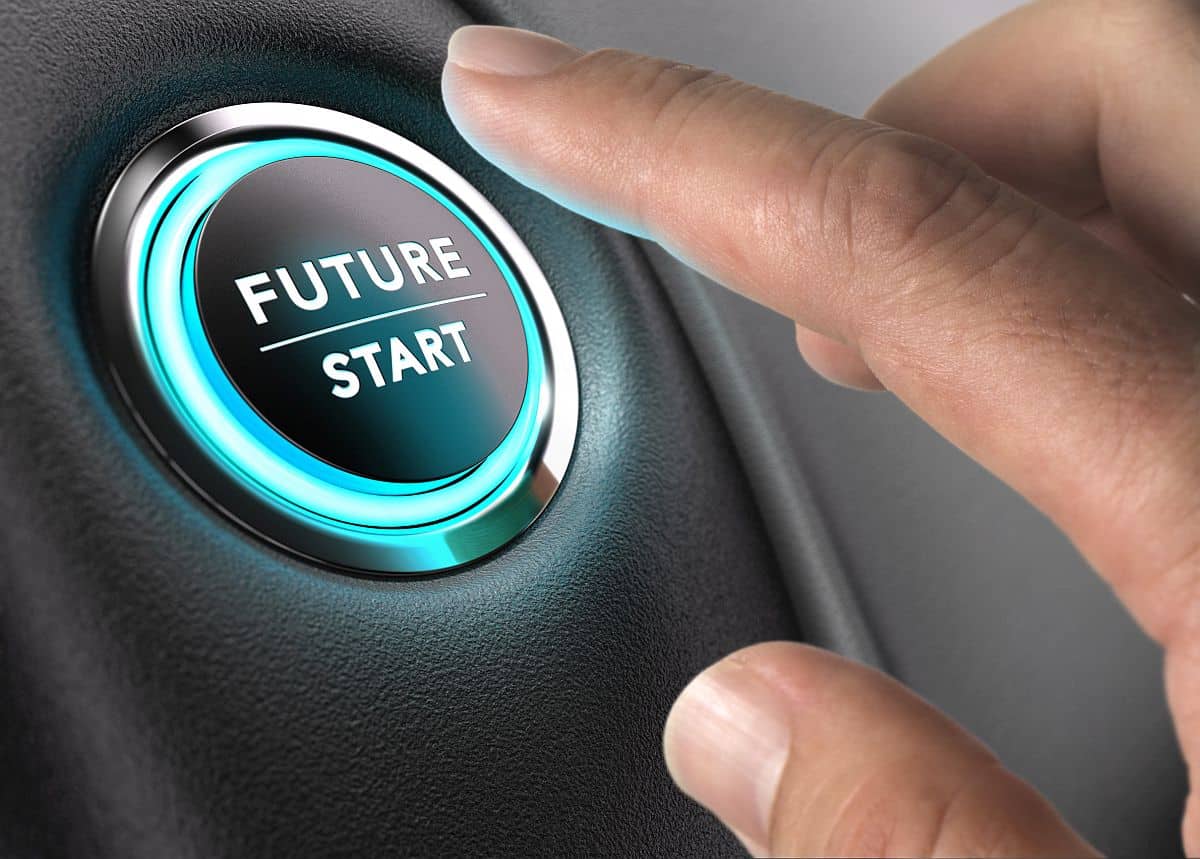 Finger about to press future button with blue light over black and grey background; talent intelligence and the public sector concept