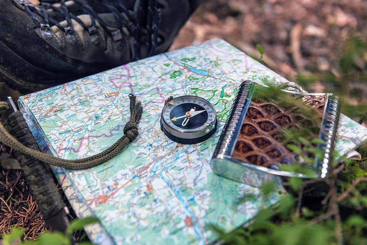tourist compass and flask on the map; Hiring for Telecom concept