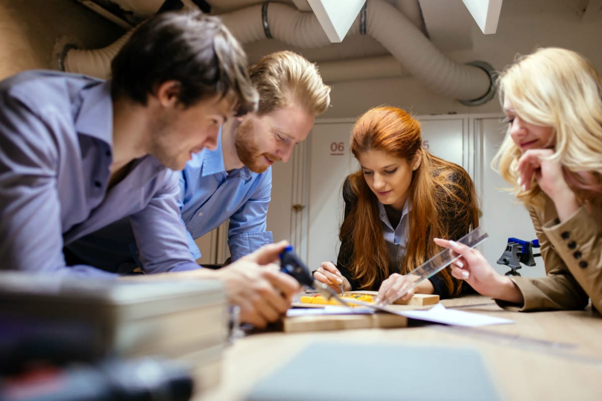 team working at desk representing unconscious bias in a company culture