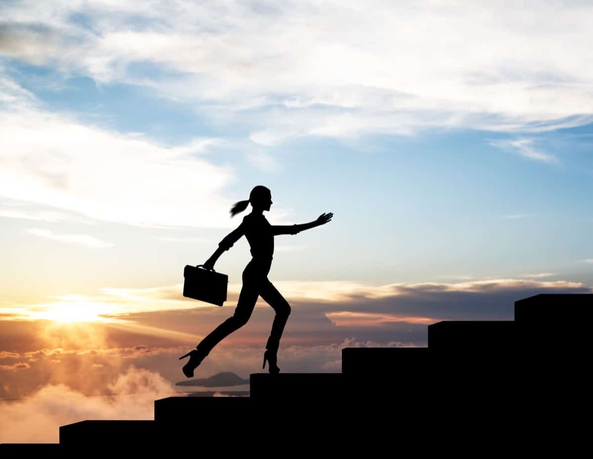 Silhouette of woman rise up on stairs, successful insurance recruiting concept.