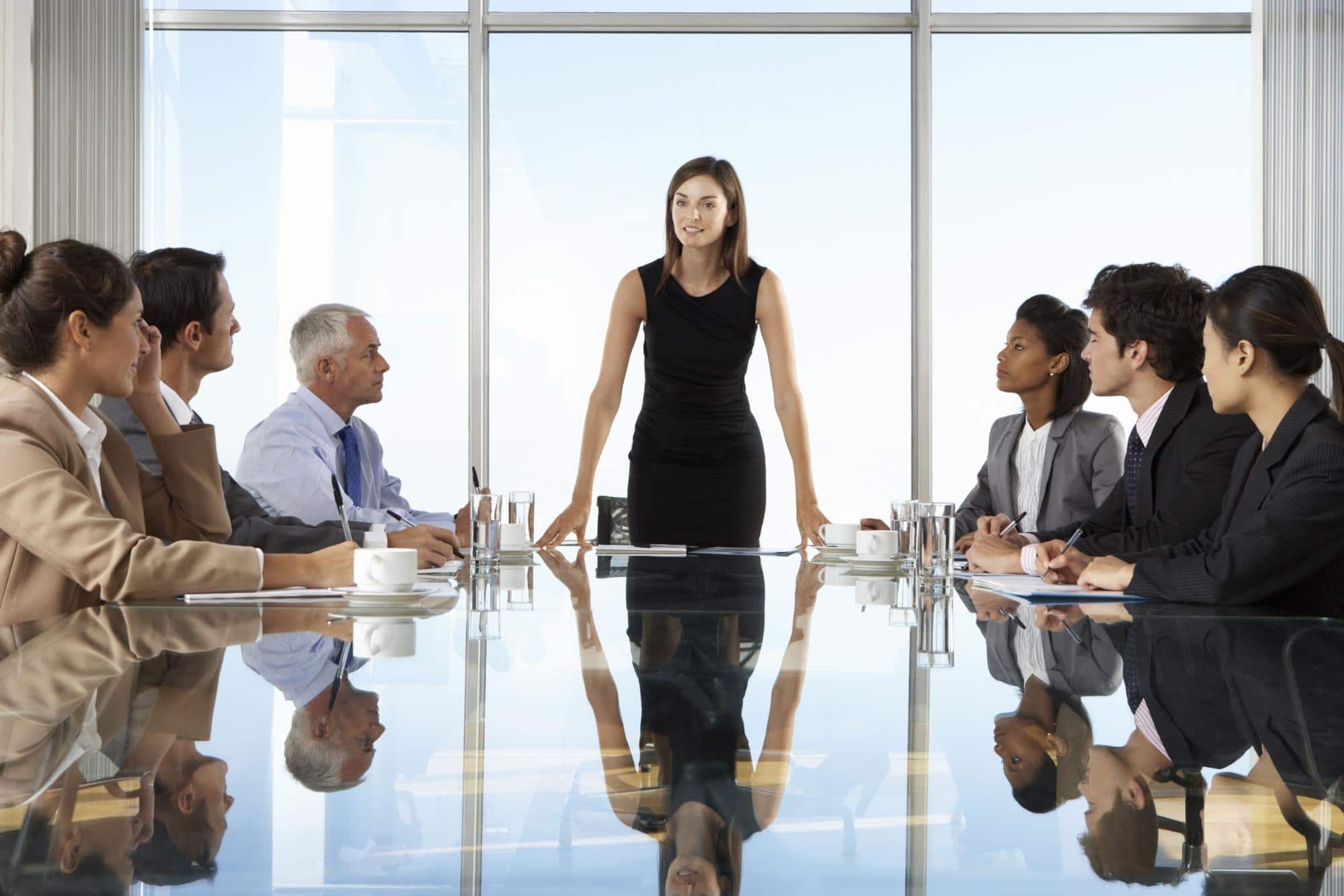 women at the head of a board meeting; representing the need for more women in leadership roles in the pharmaceutical industry