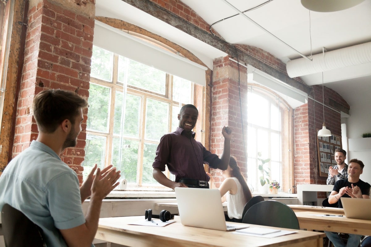 Businessman celebrating success - Better Employee Retention Starts With Recruitment