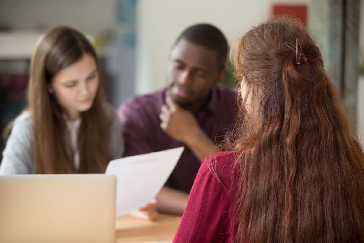 Female applicant during job interview; contingent workers concept