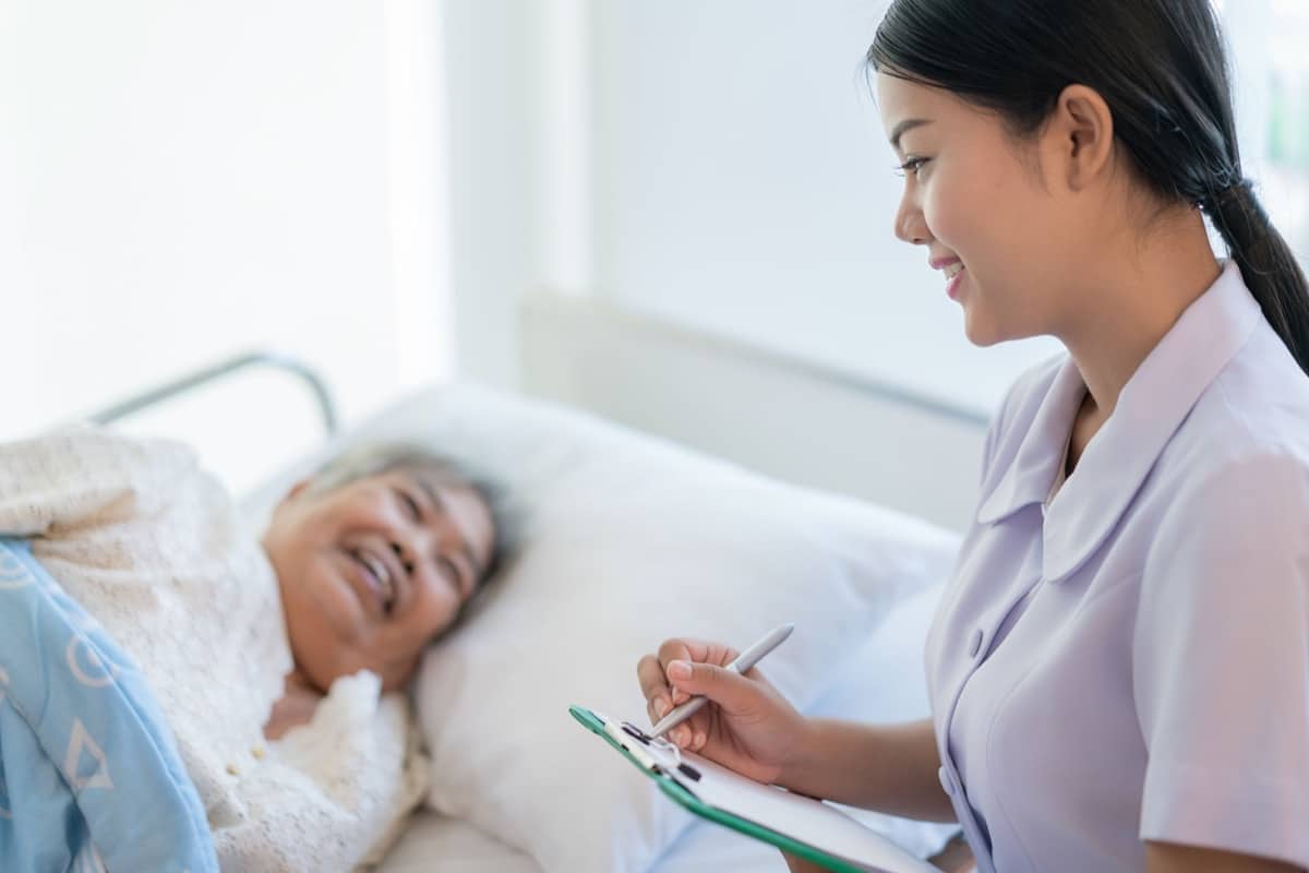 Nurse cares for a elderly woman; healthcare talent management concept