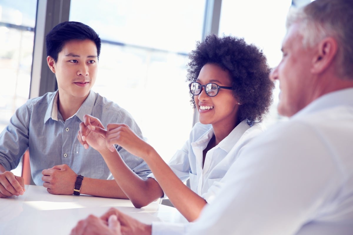 Three business professionals working together. Human capital disclosure concept.
