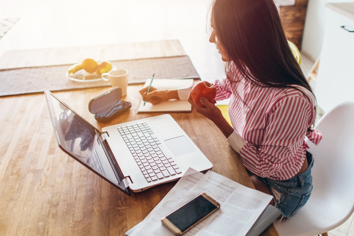 Young woman at home planning family budget and finances