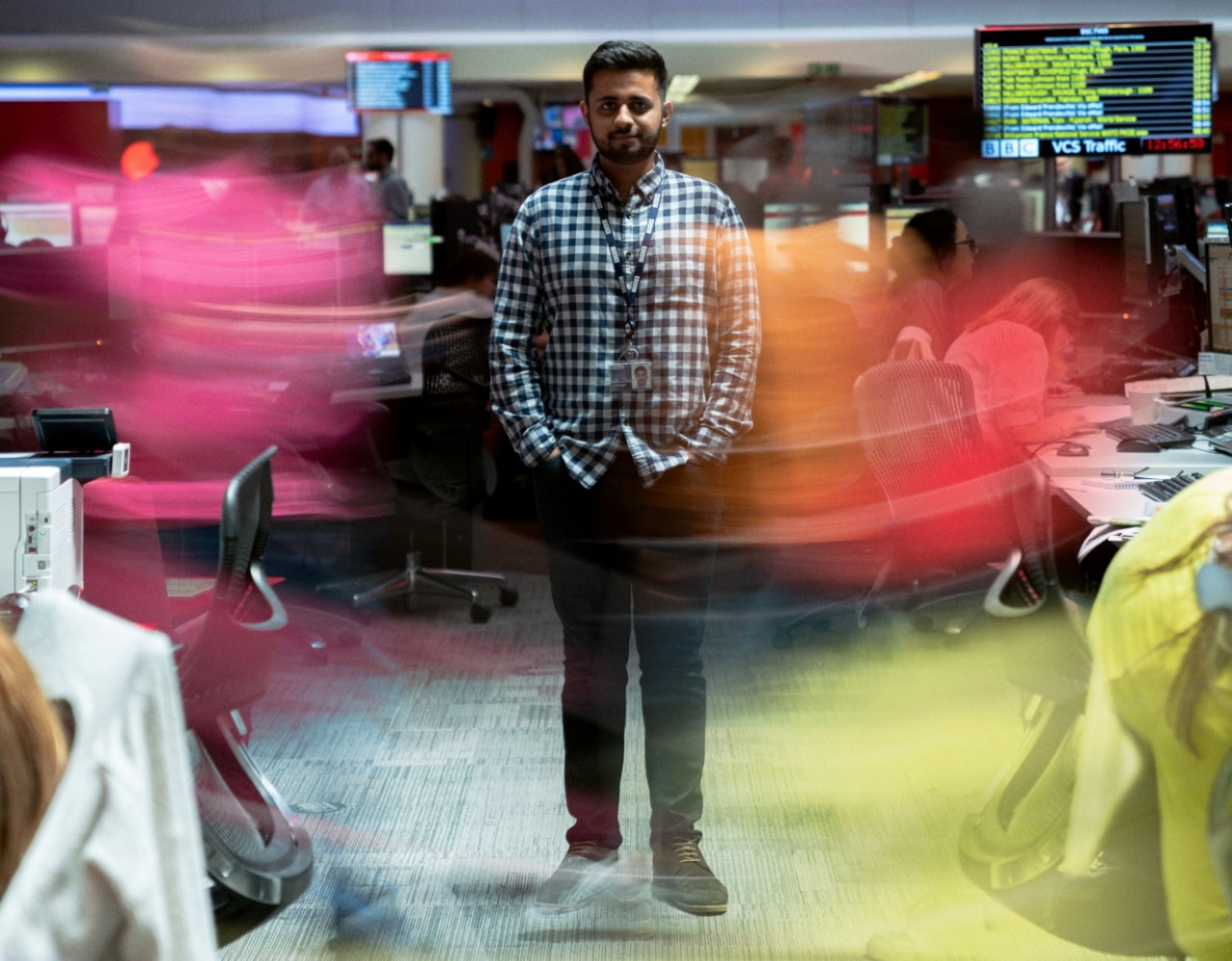 developer in a busy office; global talent intelligence concept