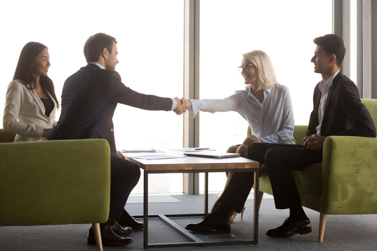 vet shaking hands a business meeting; veterans resume concept