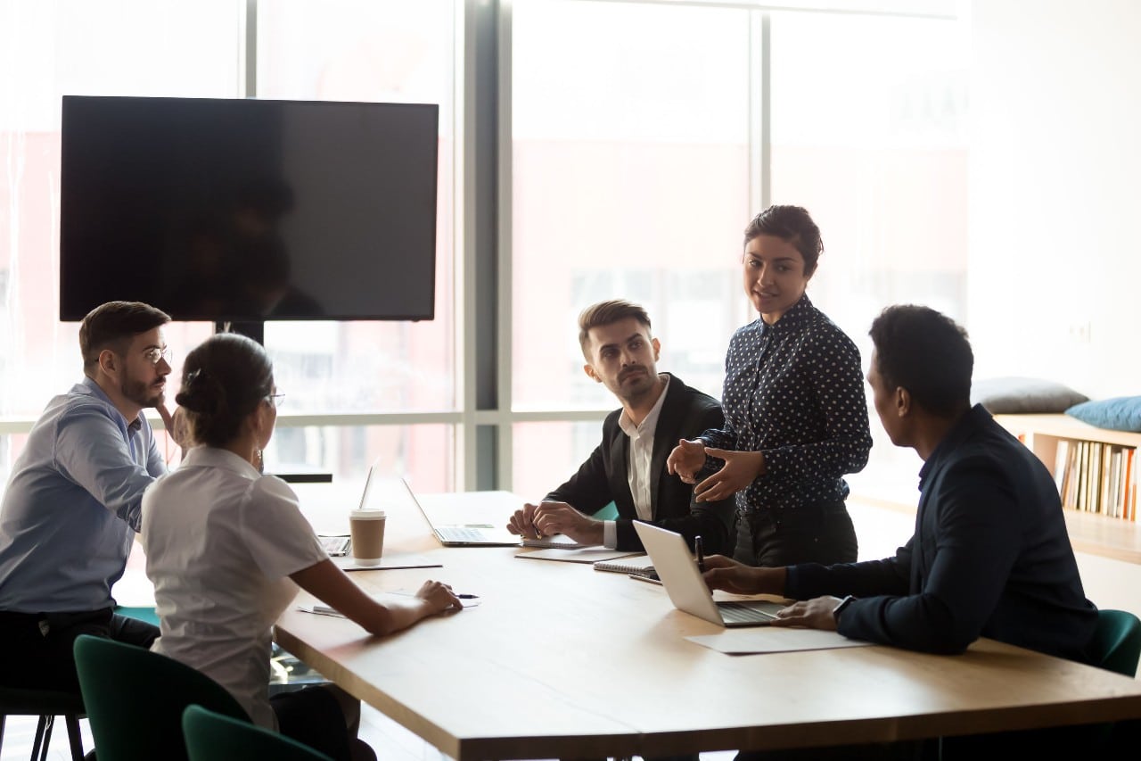 young professions in a conference room at a hip office; managers should encourage internal mobility concept