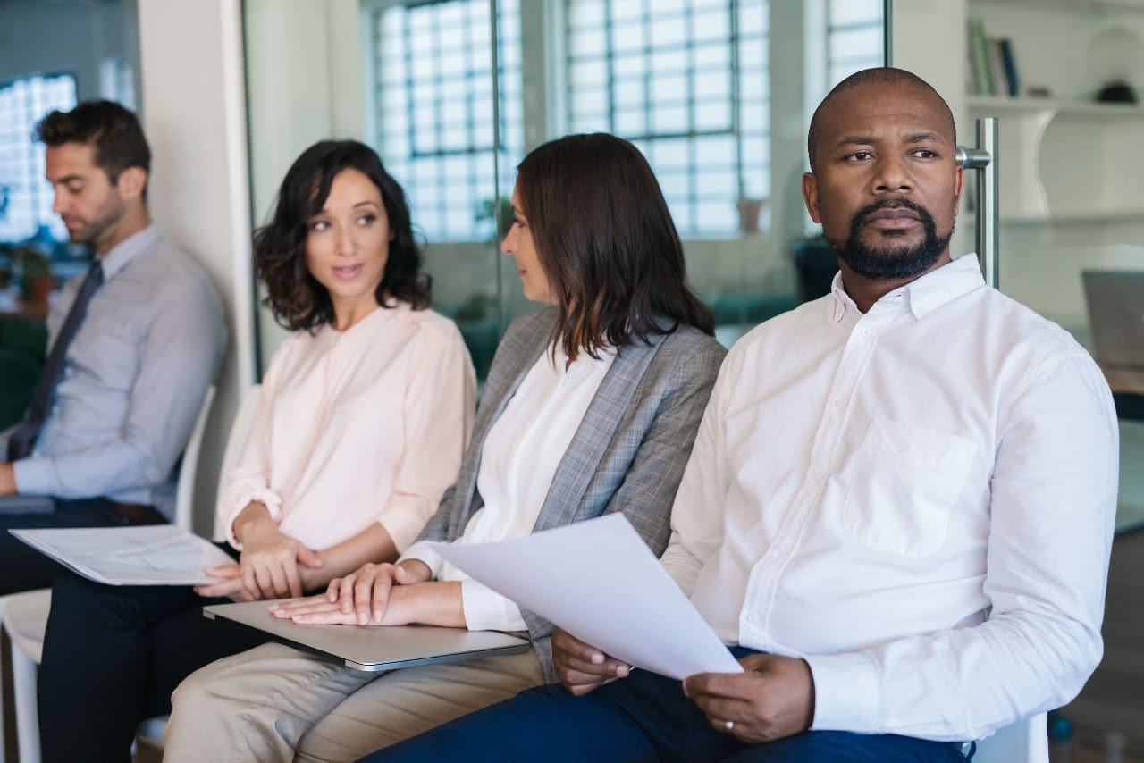 job prospects holding applications wait in line, some nervously, some confidently; concept: attract better talent with better job postings